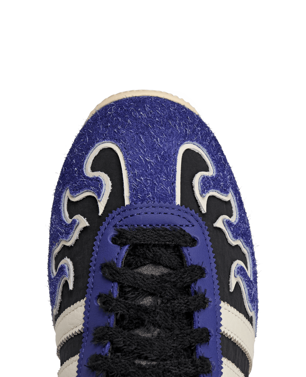 Close-up of the adidas Japan LO Brain Dead sneaker toe box with blue hairy suede flame detailing.